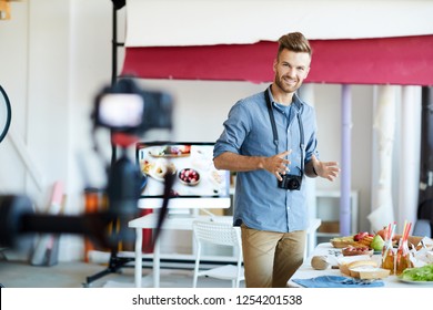 Portrait Of Handsome TV Show Host Filming Cooking Program In Studio , Copy Space