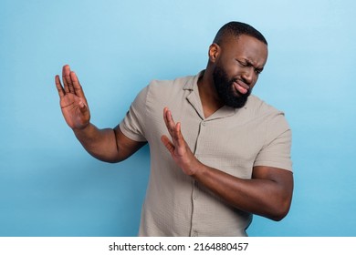 Portrait Of Handsome Unsatisfied Person Arms Palms Block Empty Space Isolated On Blue Color Background