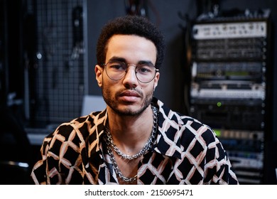 Portrait Of Handsome Young African American Sound Engineer Or Singer Wearing Stylish Clothes And Accessories Looking At Camera