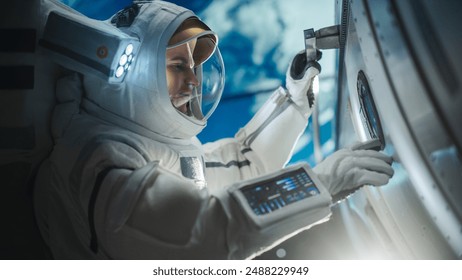 Portrait of a Handsome Young Astronaut Investigating a Satellite in Outer Space. Trained Professional in a Space Suit Performing Extravehicular Activity Outside the Spacecraft - Powered by Shutterstock