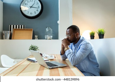 Portrait Of Handsome Young Black Man Working With Laptop At Home.