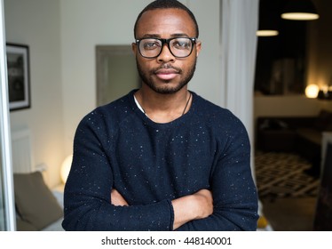 Portrait Of Handsome Young Black Man Looking At Camera At Home.