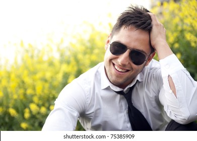 Portrait Of A Handsome Young Business Man With Sunglasses