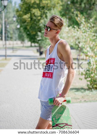 Similar – Close up of young man with sunglasses holding surfboard