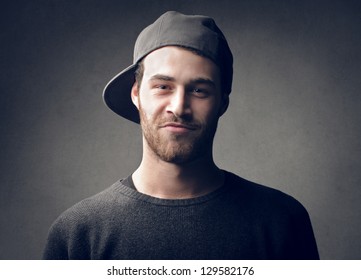 Portrait Of Handsome Young Man With Cap