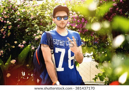 Similar – Close up of young man with sunglasses holding surfboard