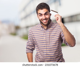 Portrait Of A Handsome Young Man Holding A Credit Card