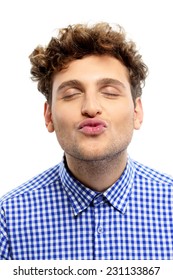 Portrait Of A Handsome Young Man Kissing Camera