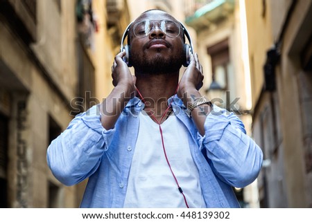 Similar – Young happy black man is listening to music