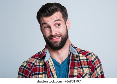 Really? Portrait Of Handsome Young Man Looking Sarcastic While Standing Against White Background