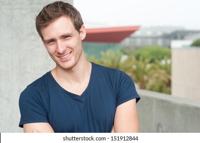 Portrait Of A Handsome Young Man Standing Outside