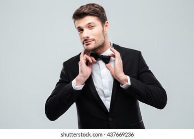 Portrait Of Handsome Young Man In Tuxedo With Bowtie