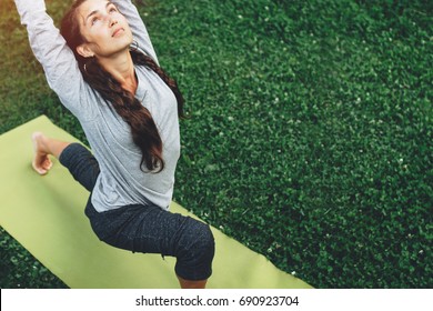 Portrait Of Happiness Young Woman Practicing Yoga On Outdoors.Yoga And Relax Concept. Beautiful Girl Practice Asana