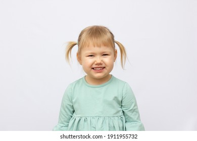 Portrait of happy 4 years old girl isolated on gray background