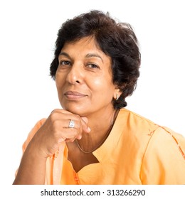 Portrait Of A Happy 50s Indian Mature Woman Smiling And Looking At Camera, Isolated On White Background.