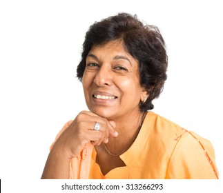 Portrait Of A Happy 50s Indian Mature Woman Smiling, Isolated On White Background.