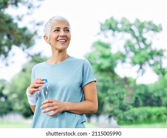 Portrait of a happy active beautiful senior woman posing after exercicing outdoors