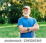 Portrait of a happy active senior posing after exercising outdoors