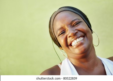 portrait of happy african adult woman looking at camera and smiling. Horizontal shape, copy space