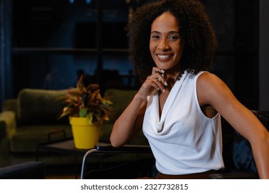 Portrait of happy african american casual businesswoman in wheelchair in office. Casual office, disability, inclusivity, business, professional and work, unaltered. - Shutterstock ID 2327732815