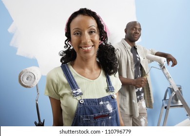 Portrait Of Happy African American Couple Painting Their New House