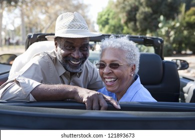 Portrait of happy African American couple in car