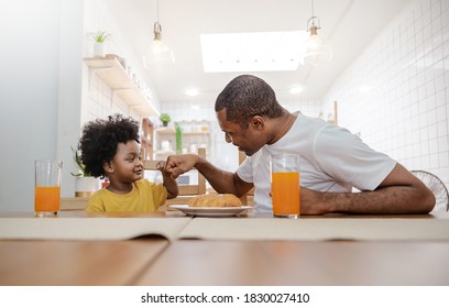 Portrait Of Happy African American Father And Son Hands Fist Bump During Breakfast Time At Dining Table. Single Dad Family Love Lifestyle, Father’s Day Concept