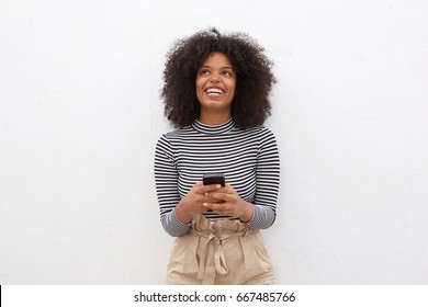 Portrait Of Happy African American Woman Holding Smart Phone