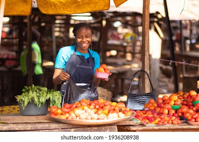 Portrait Of A Happy African Market Woman In A Local Market