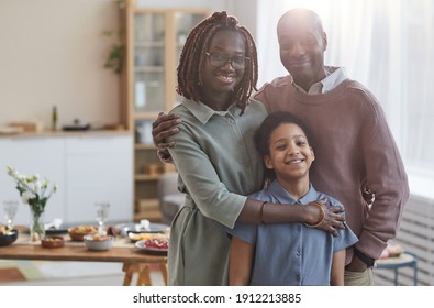 Portrait Of Happy African-American Family Looking At Camera While Posing Indoors In Cozy Home Interior With Dinner Table In Background, Copy Space