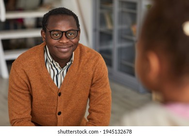 Portrait Of Happy African-American Father Coming Home From Work And Meeting Son, Copy Space