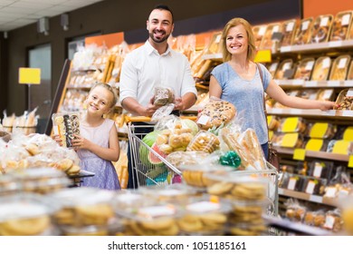 Portrait of happy american family choosing bread and sweets in bakery section in supermarket
 - Powered by Shutterstock