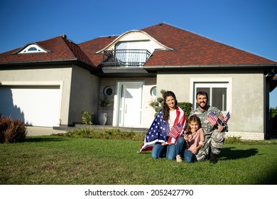 Portrait Of Happy American Military Family Welcoming Father Soldier Coming Home.