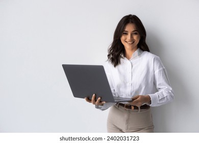 Portrait of a happy asian businesswoman working on laptop computer isolated over white background - Powered by Shutterstock