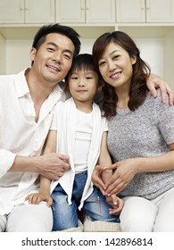 Portrait Of A Happy Asian Family