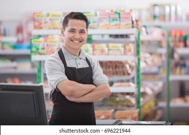 Portrait Of Happy Asian Male Shopkeeper