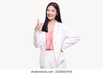 Portrait happy Asian woman shows thumb up and looking at the camera on white background.