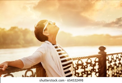 Portrait Of A Happy Attractive Mature Senior Woman 50 Years Old At Sunset