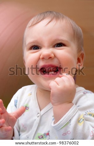 Similar – Happy adorable infant baby boy child smiling while eating two frozen fruit popsicle ice creams in simmer.