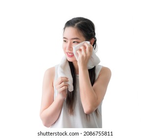 Portrait Of Happy Beautiful Asian Woman Using White Towel Wiping Sweat From Her Face After Exercise Isolated On White Background. Beauty Girl Smiling And Wipe Her Face With Towel After Washing Face.