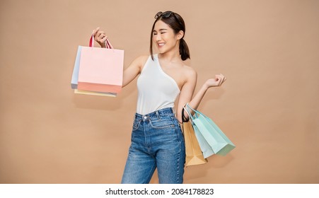 Portrait Of Happy Beautiful Shopaholic Asian Woman Carry Shopping Bags, Summer Fashion Sale Model Asia Girl With Copy Space, Outlet Sale Department Store Advertising Concept Isolated Banner Background