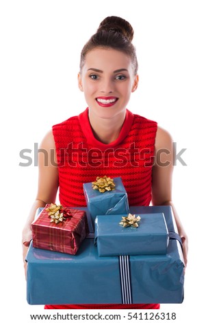 Portrait of happy beautiful woman holding gift boxes. Isolated on white