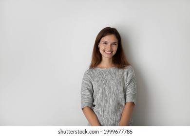 Portrait of happy beautiful woman on grey studio background isolated, excited young female with healthy toothy smile looking at camera, natural beauty, confident businesswoman posing for photo - Shutterstock ID 1999677785