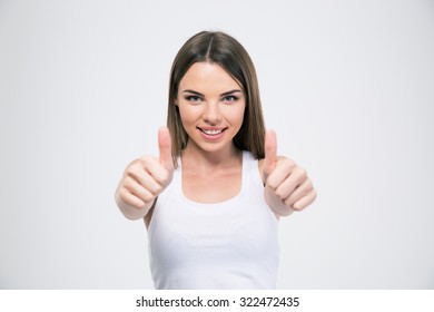 Portrait of a happy beautiful woman showing thumbs up isolated on a white background - Shutterstock ID 322472435