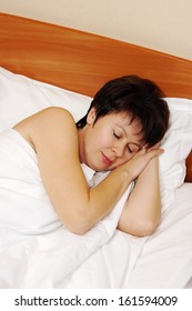 Portrait Of A Happy Beautiful Woman Sleeping In The Bed