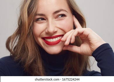 Portrait Of A Happy And Beautiful Woman Or Women With A Big Smile On Her Pretty Makeup Face With Big Red Lips, Thinking And Looking Attractive