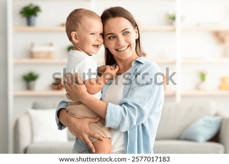 Similar – Image, Stock Photo Happy adorable infant baby boy child smiling while eating two frozen fruit popsicle ice creams in simmer.
