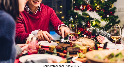 Portrait Of Happy Big Family Celebrating Santa Hats Having Fun And Lunch Together Enjoying Spending Time Together In Christmas Time At Home