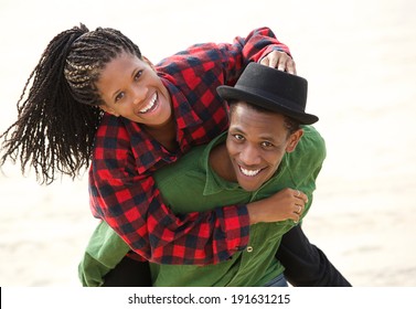 Portrait of a happy black couple smiling outdoors