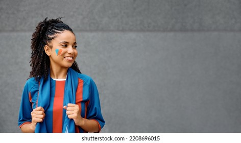 Portrait of happy black female soccer fan against gray background. Copy space. - Shutterstock ID 2208696015